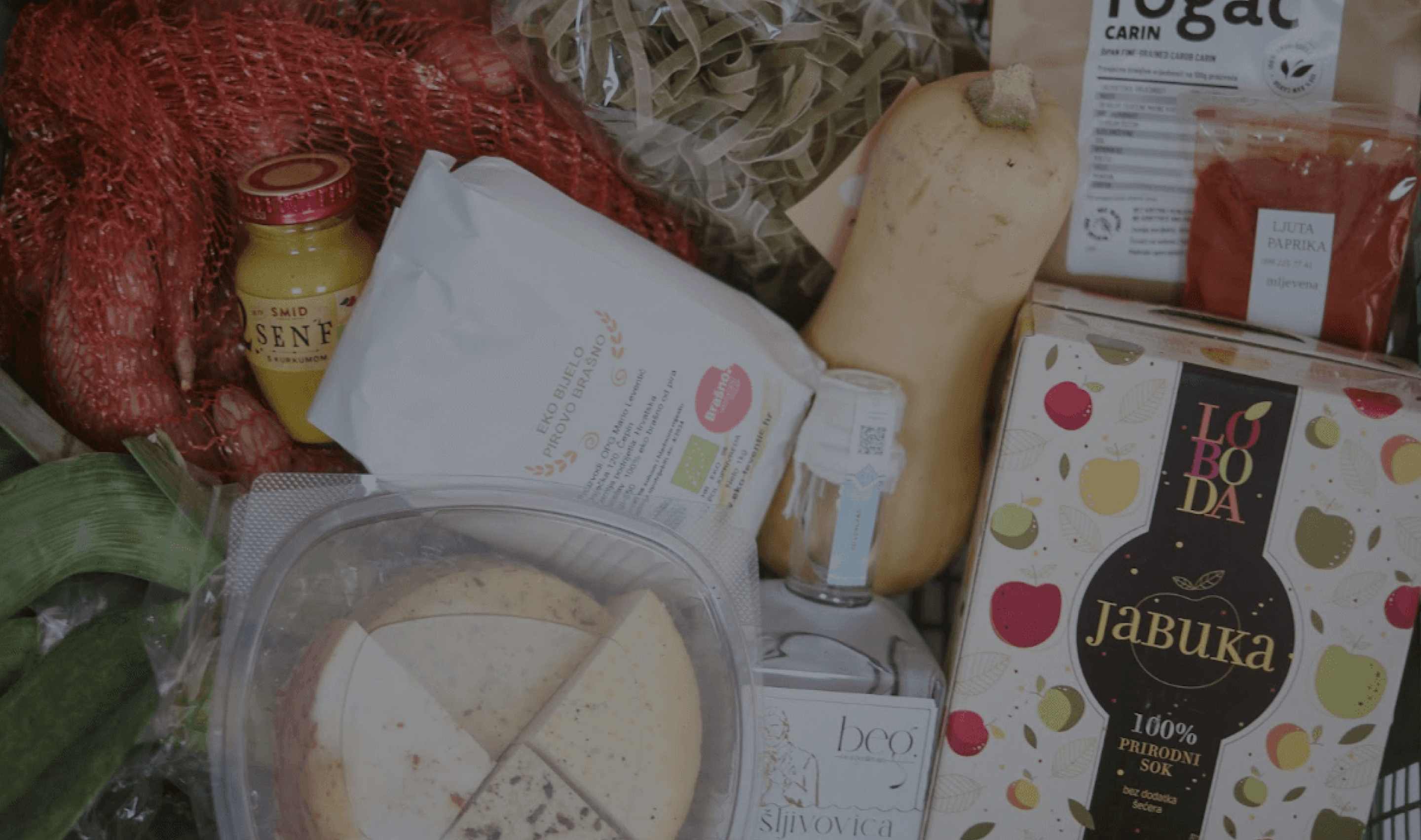 A crate of produce and preserves packed by local growers